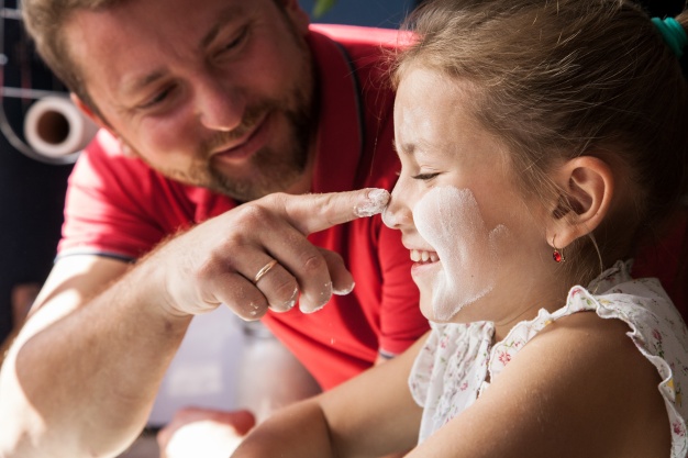close up of father touching his daughter s nose 23 2147624002