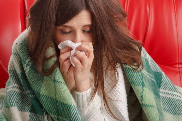 close up of ill teenager with a tissue next to her nose 1208 33