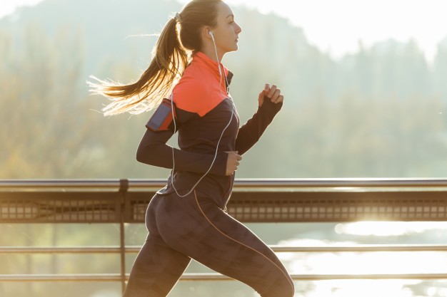 healthy woman running with blurred background 23 2147600427