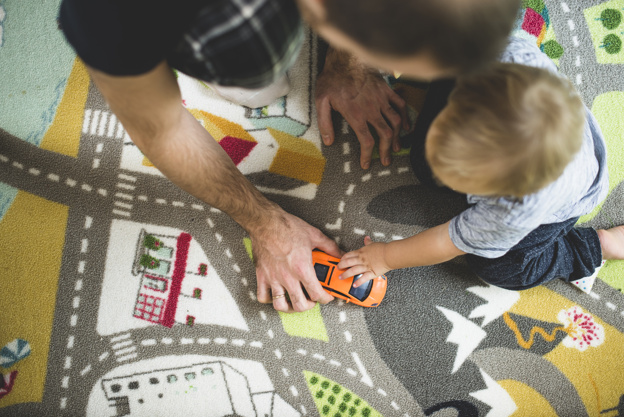 father and son playing with a toy car 23 2147615862