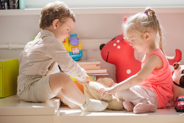 kids sitting playing with fluffy toy 23 2147664231