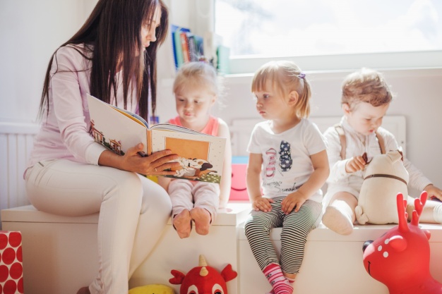 woman reading to kids in school 23 2147663894