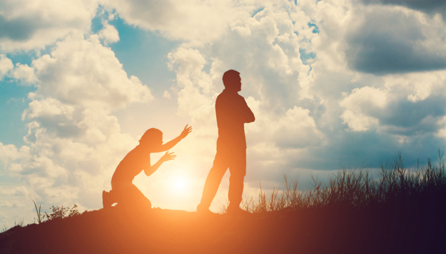 silhouette of angry man with his wife kneeling 1150 353