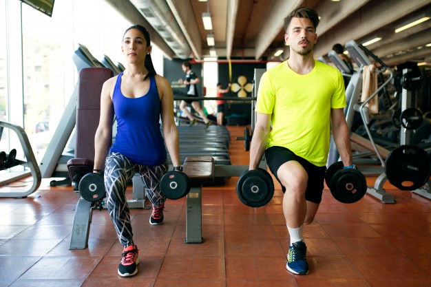 sporty young couple doing muscular exercise in gym 1301 5721