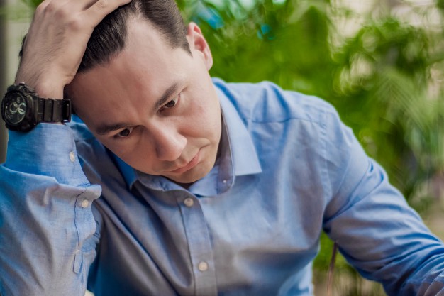 stressed man emotion portrait alone man indoor portrait businessman in depression with hands on forehead 1391 591